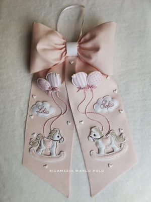 Cavallucci e palloncini rosa