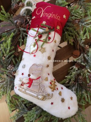 Orso con coniglio e slitta