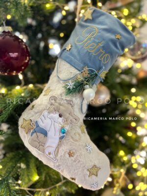 Orso con lanterna, fascia azzurro polvere.